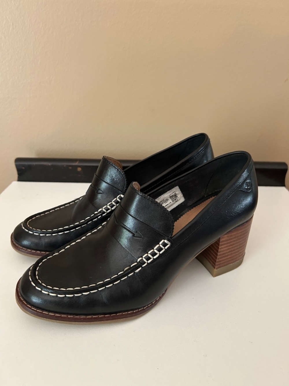 Sperry Black Leather Penny Loafers with White Stitching and Brown Welt